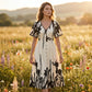 Elegante vestido midi con escote en V y estampado botánico