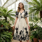 Elegante vestido midi con escote en V y estampado botánico