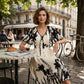 Elegante vestido midi con escote en V y estampado botánico