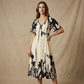 Elegante vestido midi con escote en V y estampado botánico