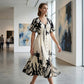 Elegante vestido midi con escote en V y estampado botánico