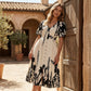 Elegante vestido midi con escote en V y estampado botánico